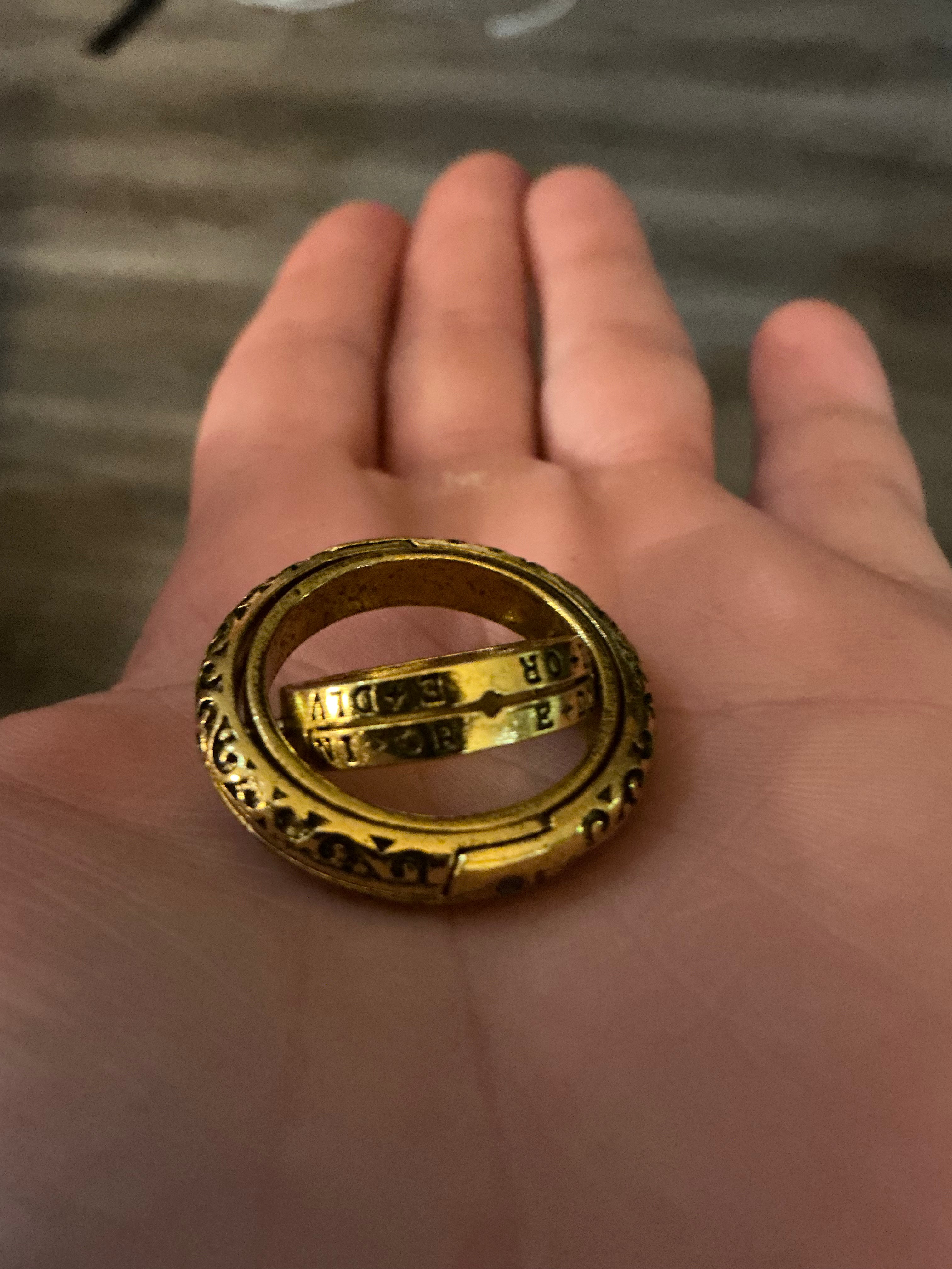 Close-up of a stainless steel Dr. Who inspired fidget ring with a rotating outer band, designed for stress relief and focus.