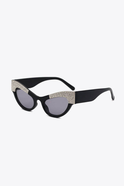Black cat-eye sunglasses with rhinestone trim.