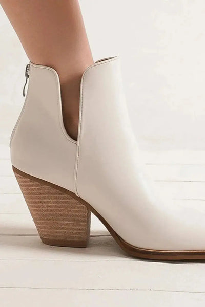 White PU leather ankle boots with a pointed toe and wooden block heel.