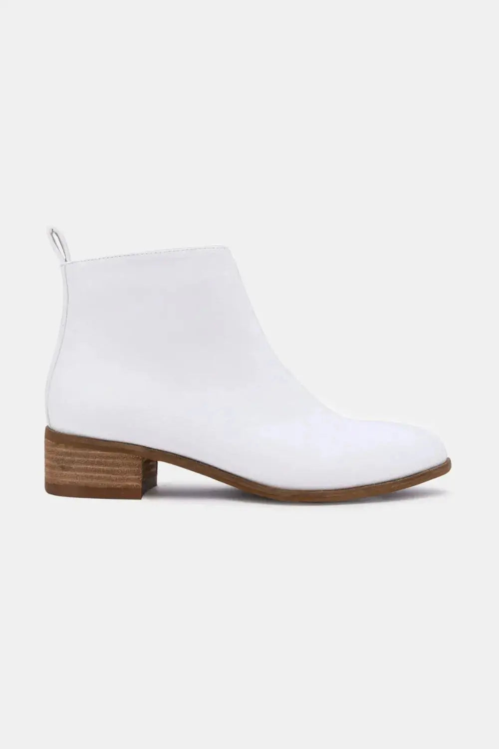 White PU leather ankle boots with a low block heel.