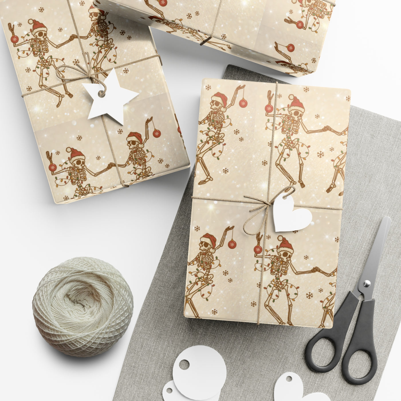Gift wrap with a black and white skeleton design and festive accents.