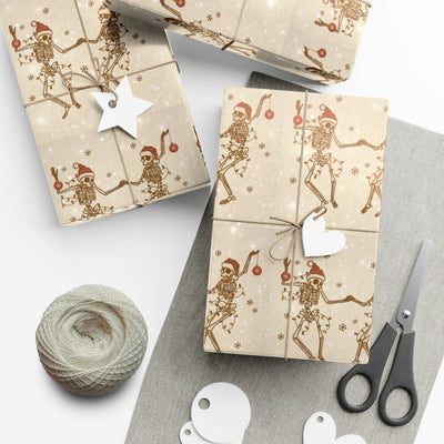 Gift wrap with a black and white skeleton design and festive accents.