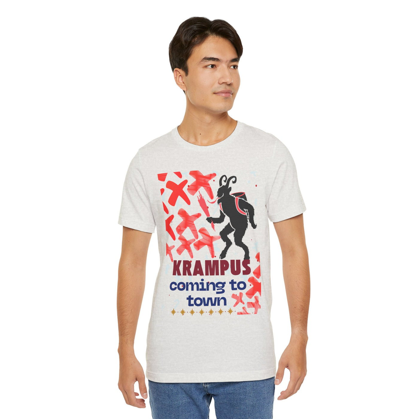 A man wears a light grey t-shirt with a Krampus graphic and text.