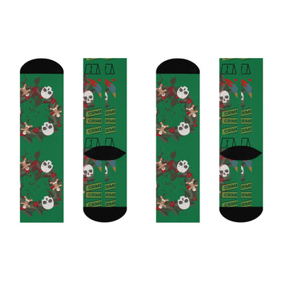 Green crew socks with a true crime wreath design featuring skulls and gingerbread men.