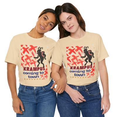 Two women in tan t-shirts with a Krampus graphic and text.