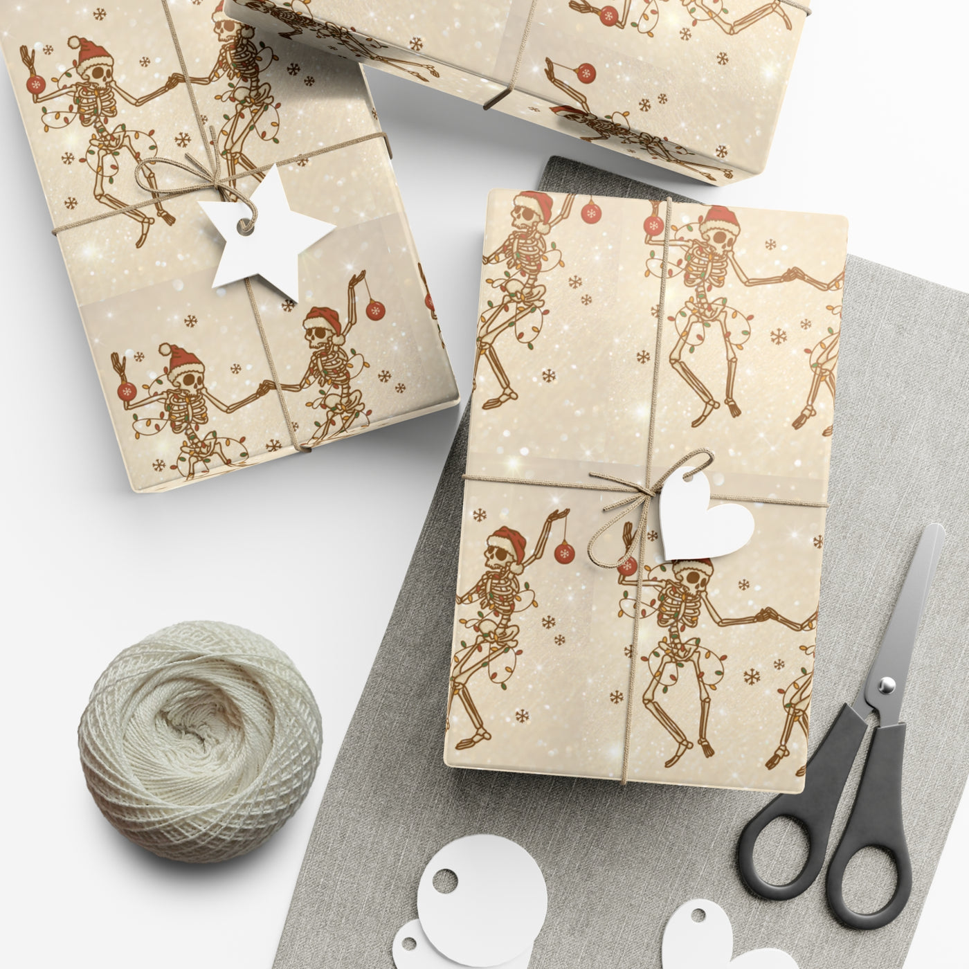 Gift wrap featuring a repeating pattern of skeletons in Santa hats and Christmas lights.