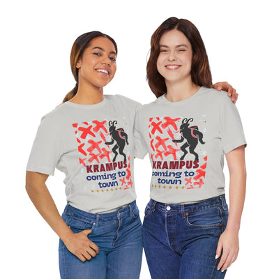 Two women in light grey t-shirts with a Krampus graphic and text.