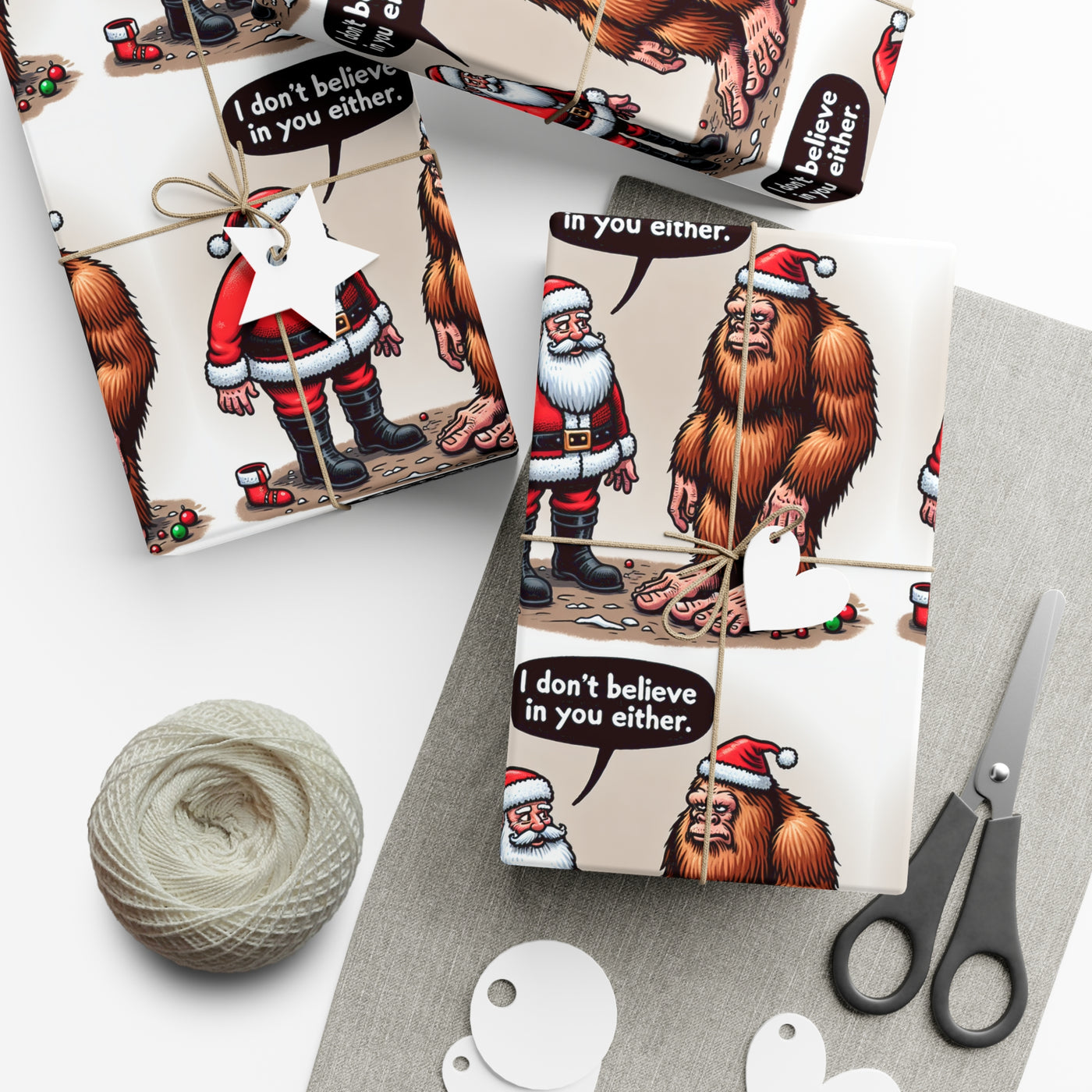 Wrapping paper with Santa and Bigfoot saying "I don't believe in you either."