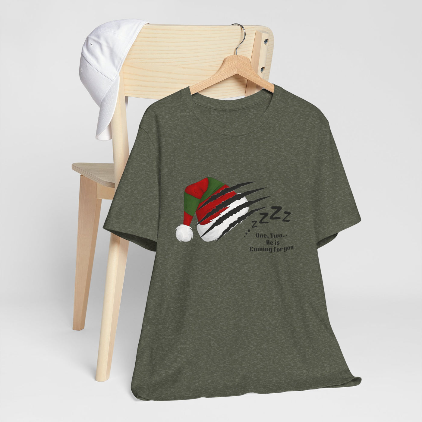 Unisex Nightmare on Elm Street holiday horror t-shirt with a graphic of a Santa hat with claw marks.