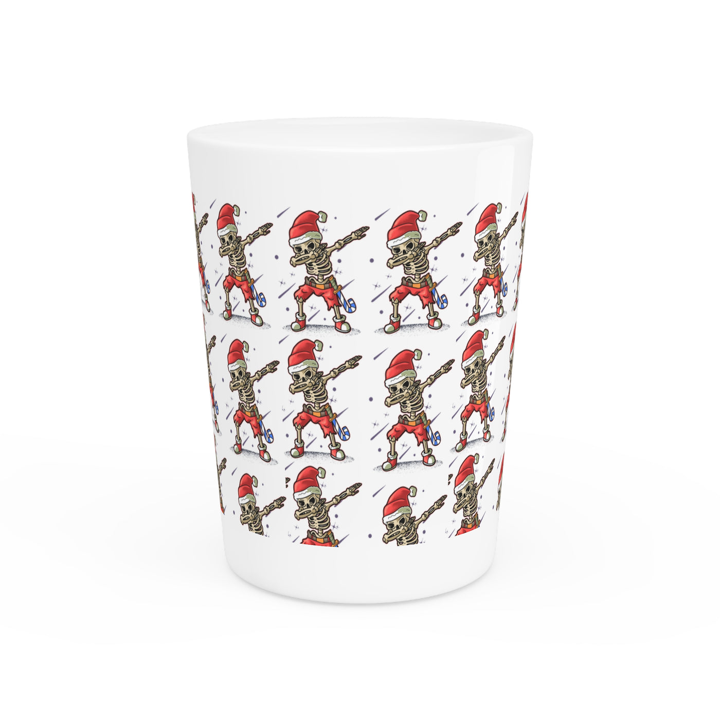 Ceramic shot glass with a repeating pattern of skeletons wearing Santa hats.