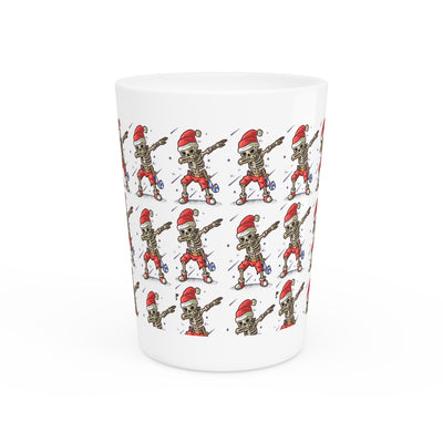 Ceramic shot glass with a repeating pattern of skeletons wearing Santa hats.
