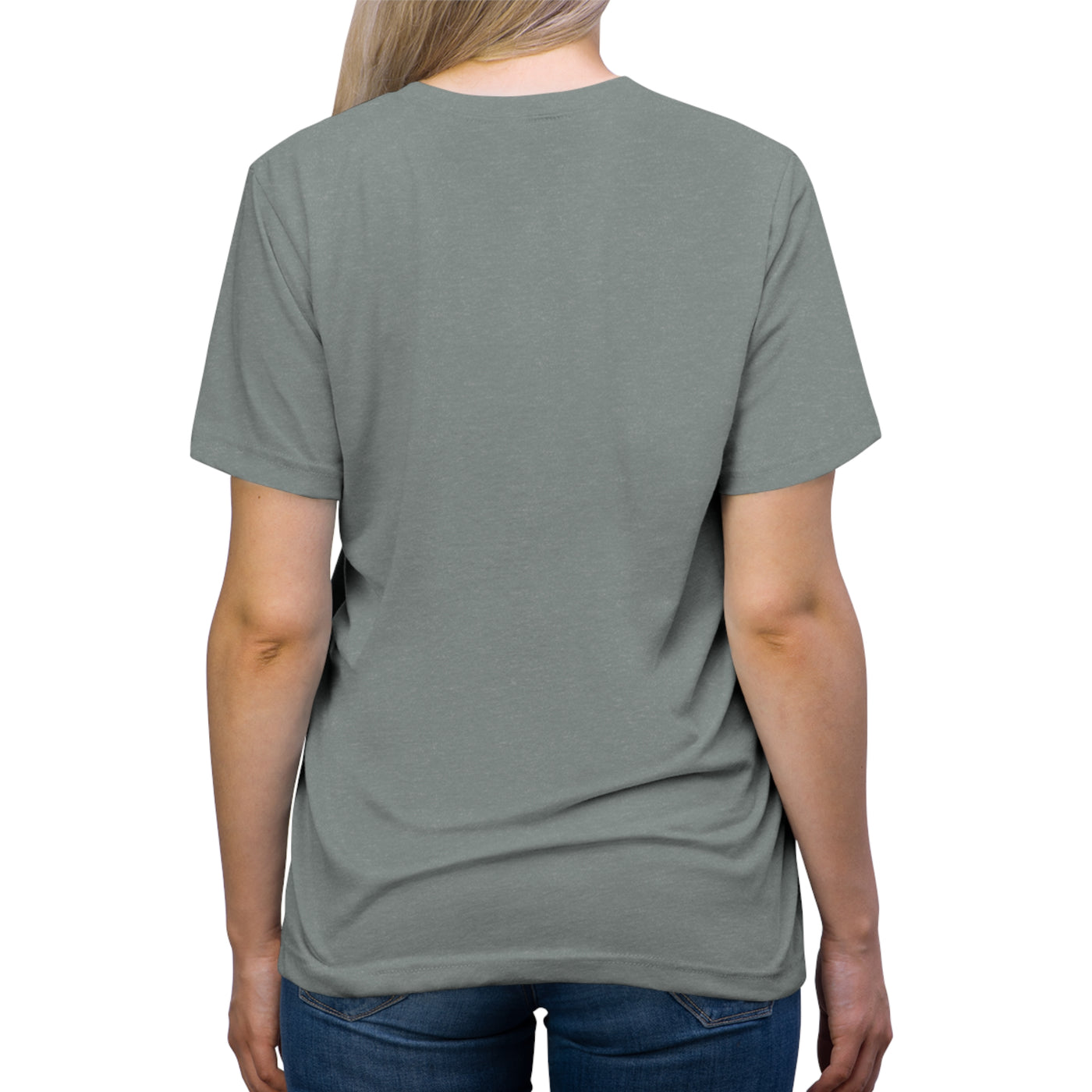 Back view of a woman wearing a grey t-shirt and blue jeans.