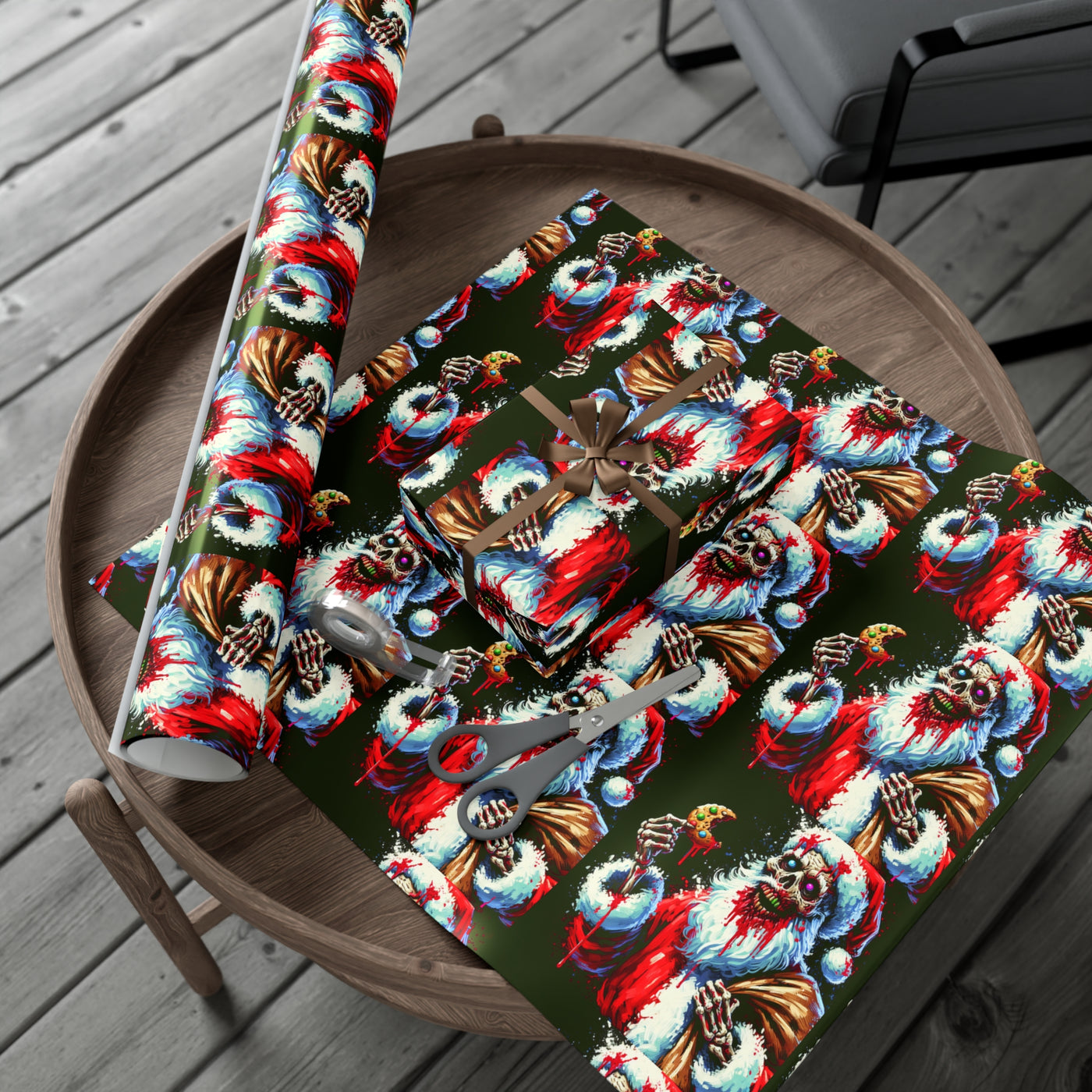 Zombie Santa wrapping paper on a wooden table with scissors and tape.