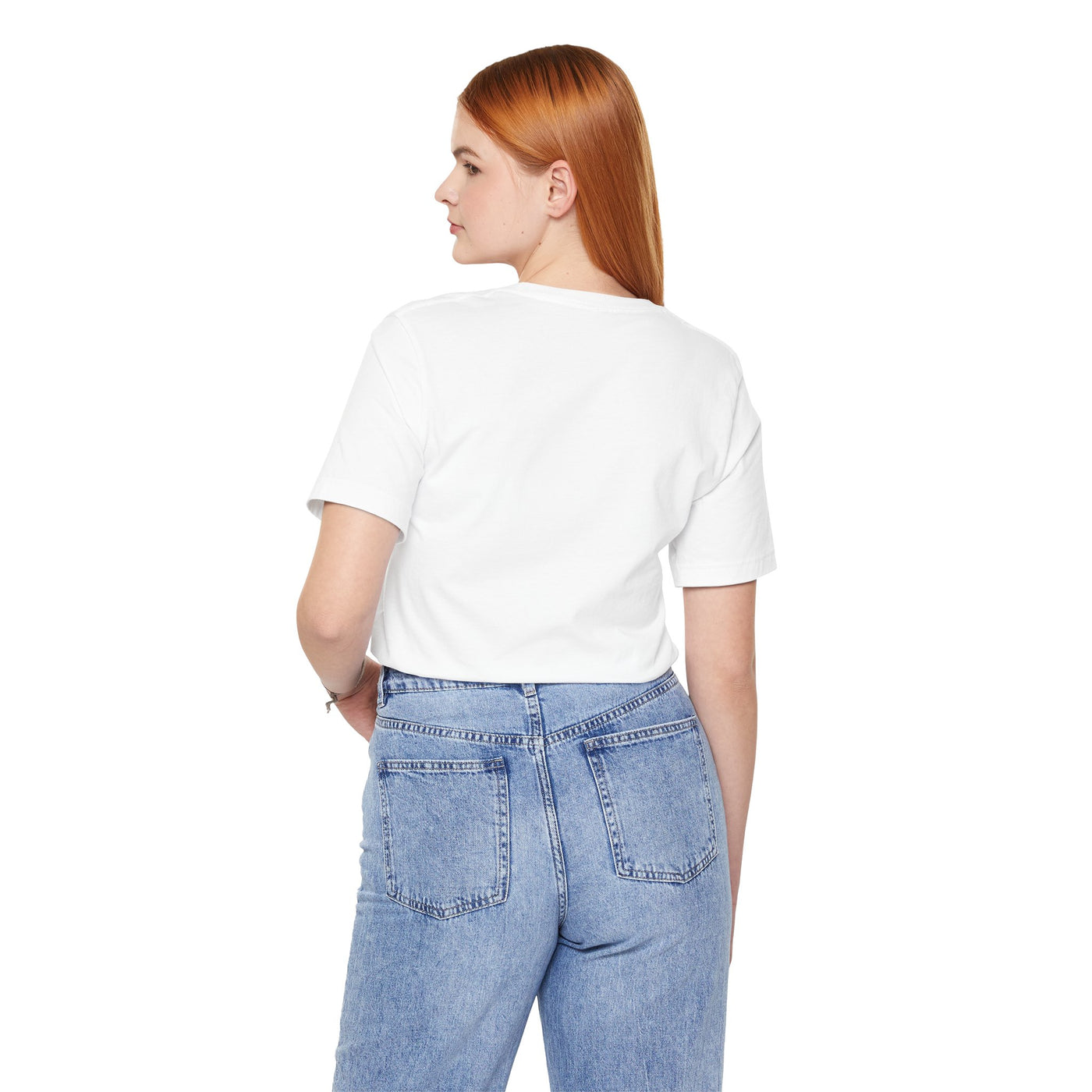 A woman wearing a white t-shirt and blue jeans.