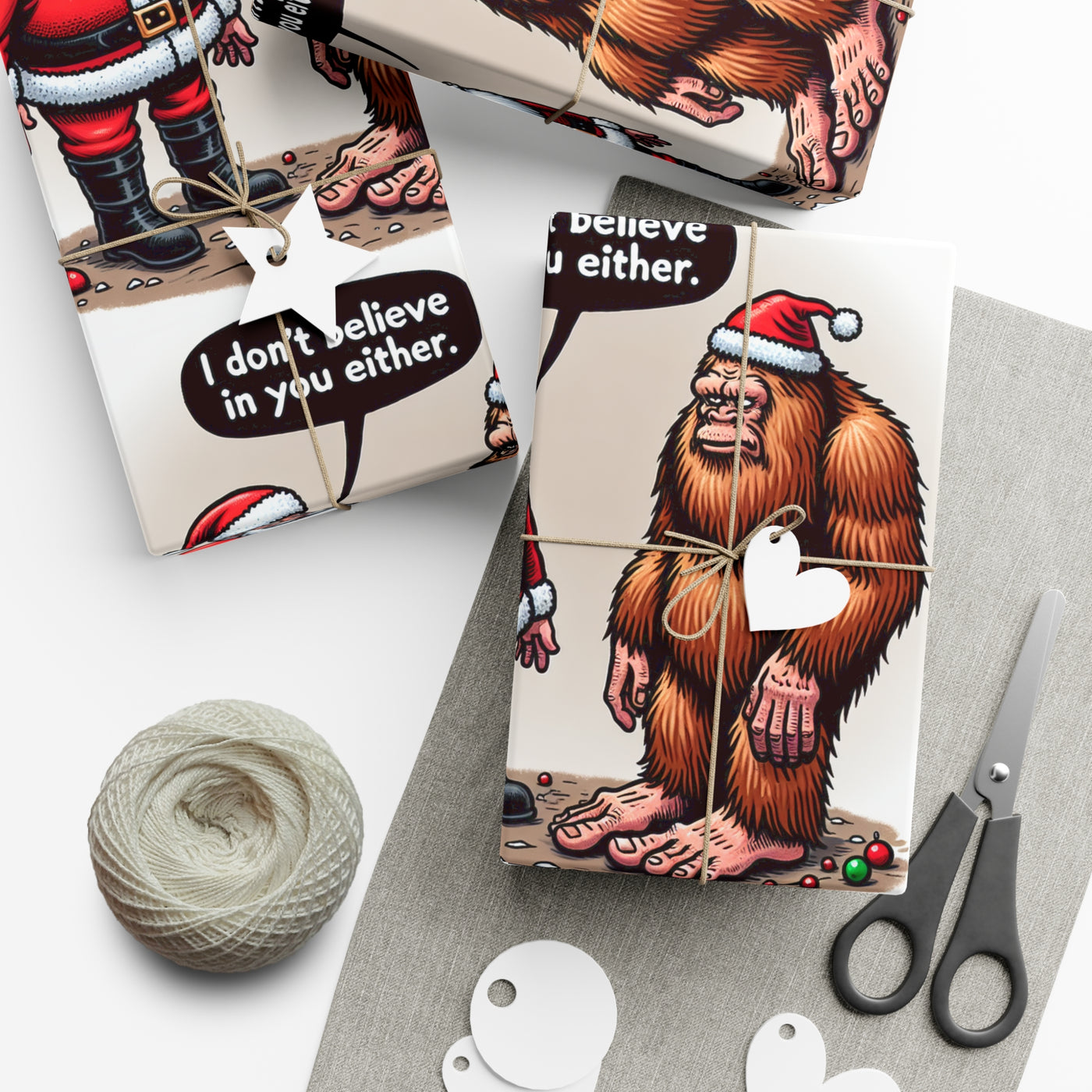 Wrapping paper with Santa and Bigfoot designs and "I don't believe in you either" text.