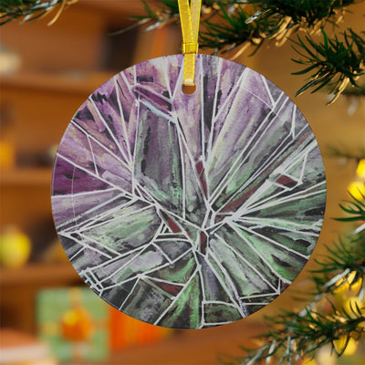 Round glass ornament with a green and purple shattered glass design.