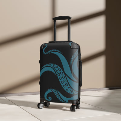 Durable suitcase with teal kraken design and 360-degree wheels, shown in sunlit room for unique travel style.