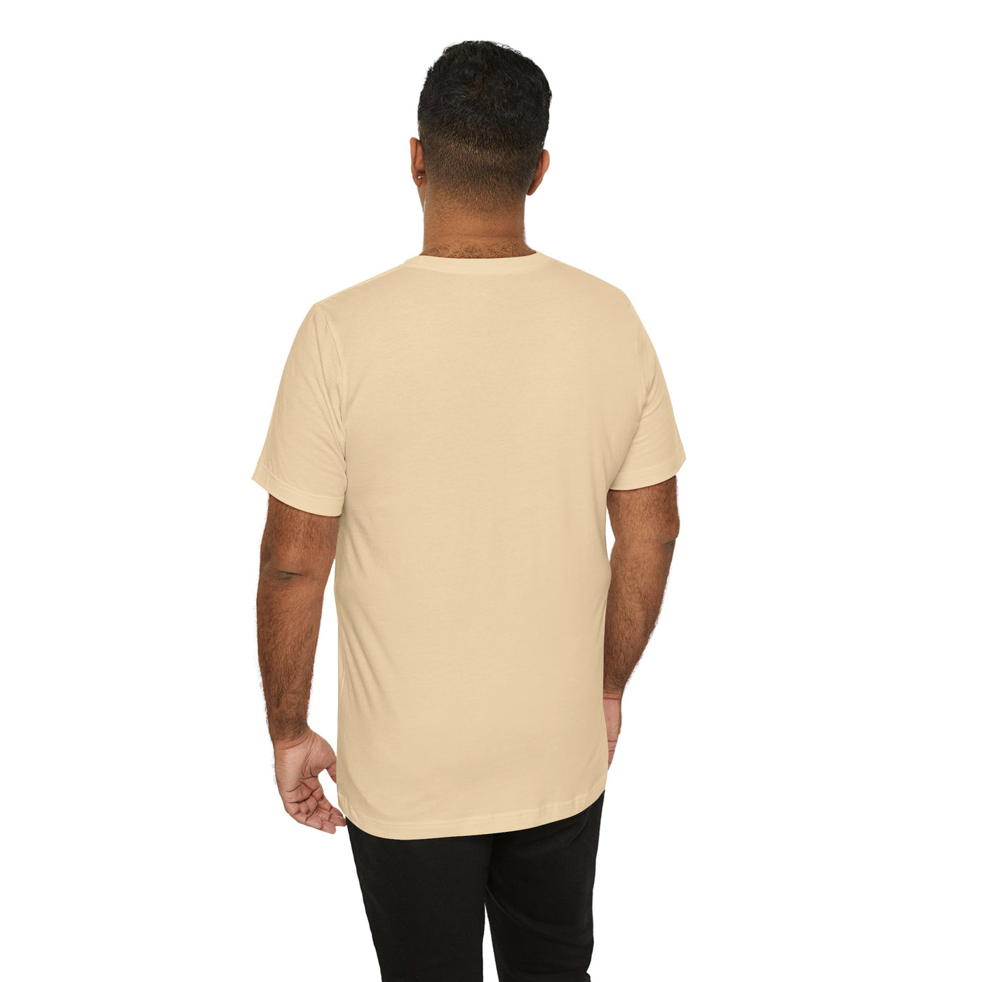 Back view of a man wearing a tan t-shirt.