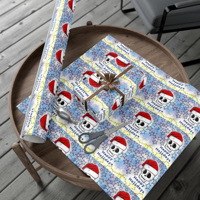 Gift wrap paper with a blue background, skulls in Santa hats, and stars.