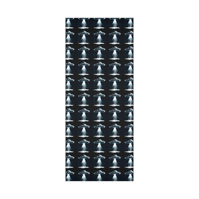Wrapping paper with a repeating pattern of UFOs emitting beams of light.