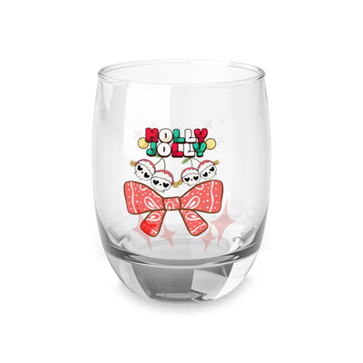 A clear whiskey glass with a "Holly Jolly" text and cherry skull design.