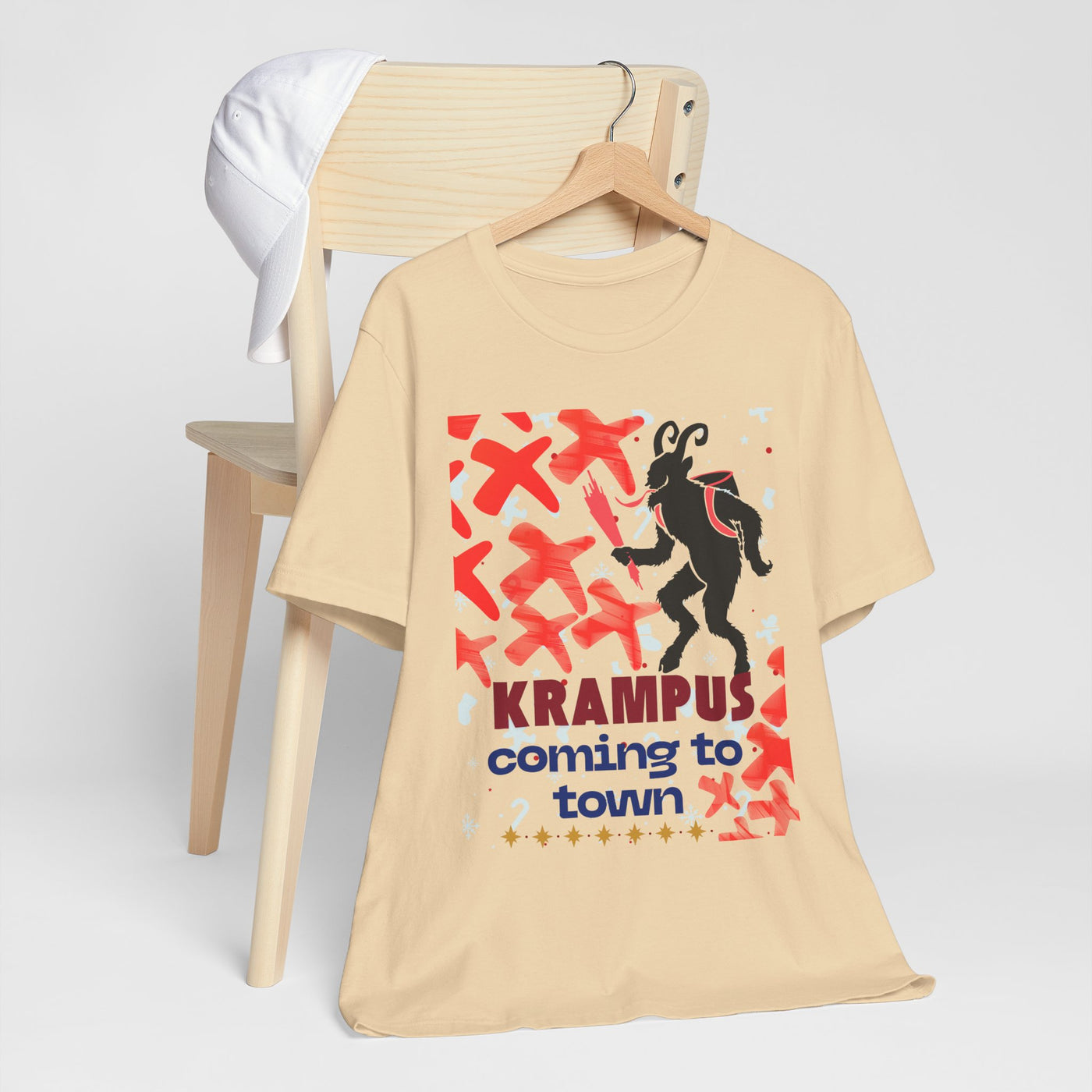 A beige t-shirt with a Krampus graphic and text.