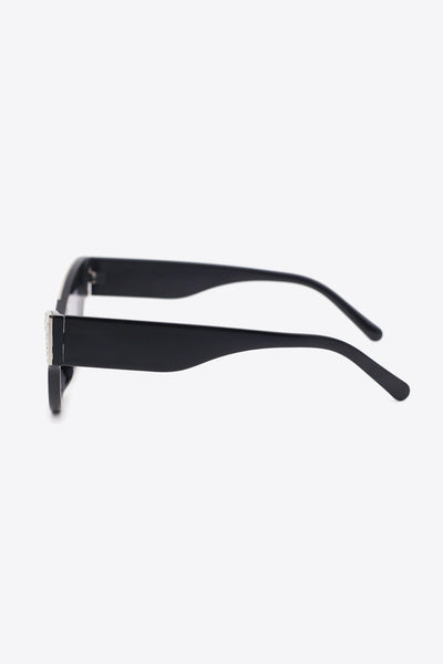 Black cat-eye sunglasses with rhinestone trim.