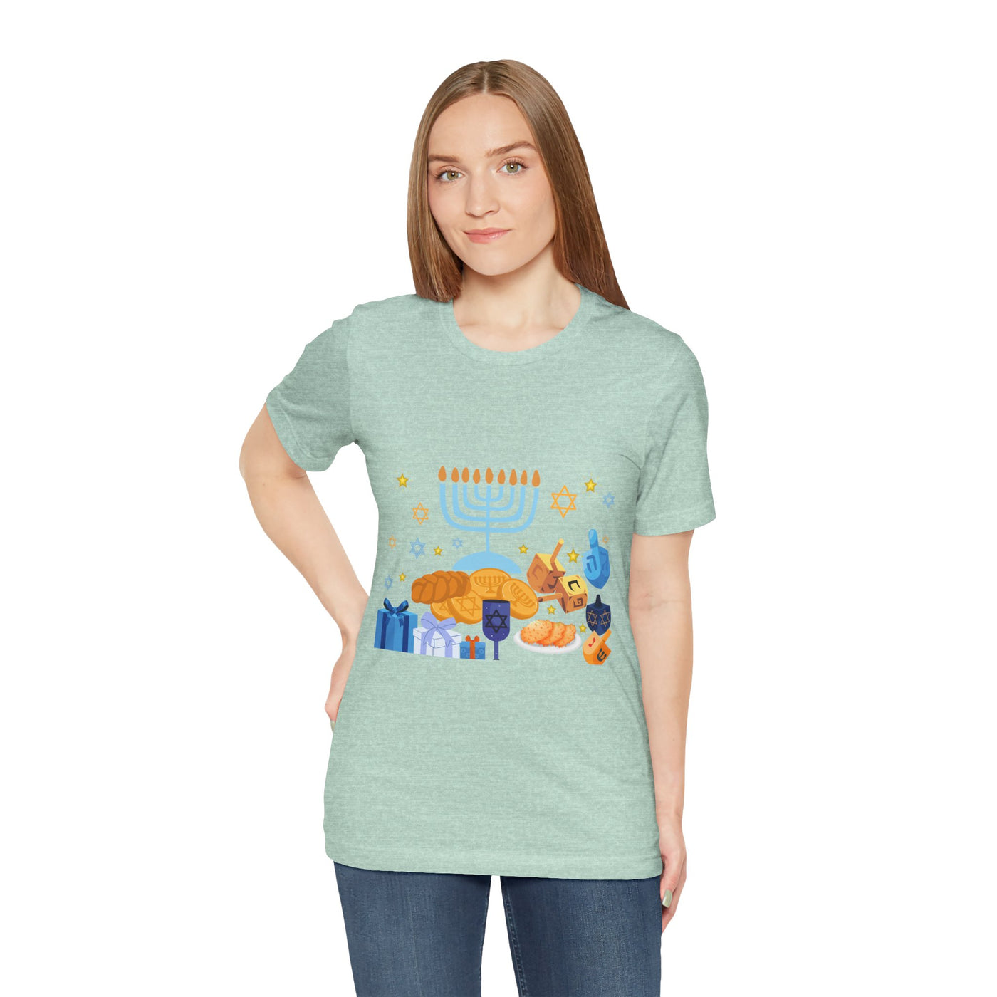Unisex light green t-shirt with a Hanukkah graphic featuring a menorah, dreidels, gelt, and gifts.