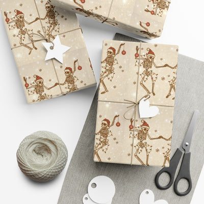 Gift wrap with a repeating pattern of dancing skeletons in Santa hats and Christmas lights.