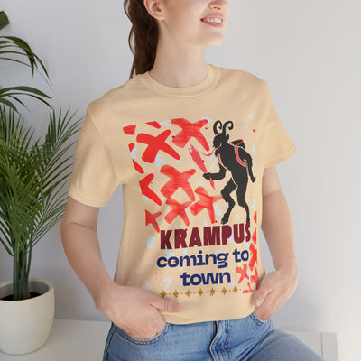A beige t-shirt with a black Krampus graphic and "Krampus coming to town" text.