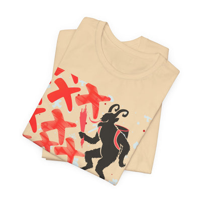 A tan t-shirt with a black Krampus graphic and red crosses.