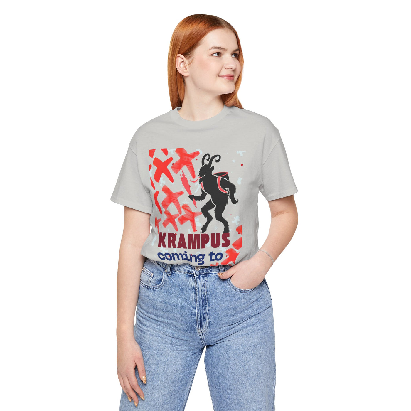 A woman wears a grey t-shirt with a Krampus graphic and text.