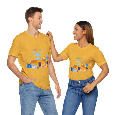 Unisex yellow t-shirt with a Hanukkah graphic featuring a menorah, dreidels, and gifts.
