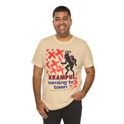 A man wears a tan t-shirt with a Krampus graphic and text.