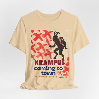 A tan t-shirt with a Krampus graphic and text that reads "Krampus coming to town".