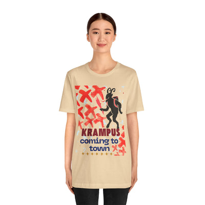 A beige t-shirt with a Krampus graphic and text.