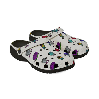 White clogs with a colorful fruit pattern.