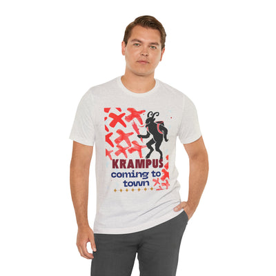 A man wears a light grey t-shirt with a Krampus graphic and text.