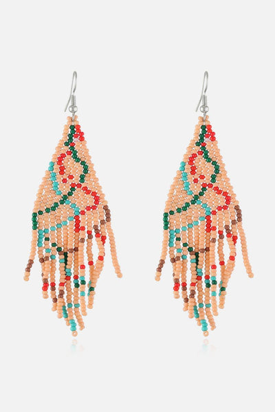 Beaded dangle earrings with a geometric pattern in red, green, and turquoise.