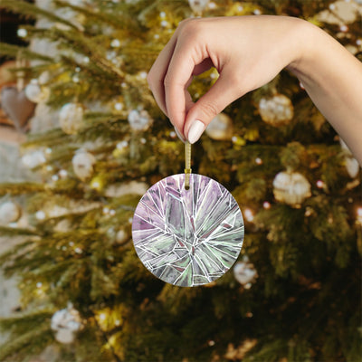 Round glass ornament with a green and purple shattered glass design.