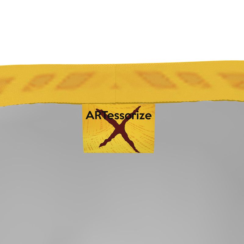 Yellow fabric band with a tag featuring a dark red X and the text ARTessorize.