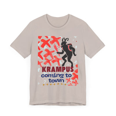 A tan t-shirt with a Krampus graphic and text that reads "Krampus coming to town".