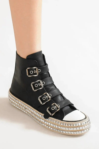 Black multi-buckle platform sneakers with studded trim.