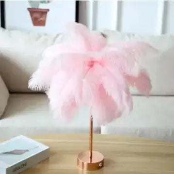 Pink feather table lamp with a rose gold base.