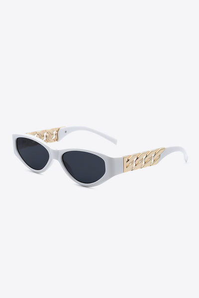 White cat-eye sunglasses with gold chain detail on the temples.