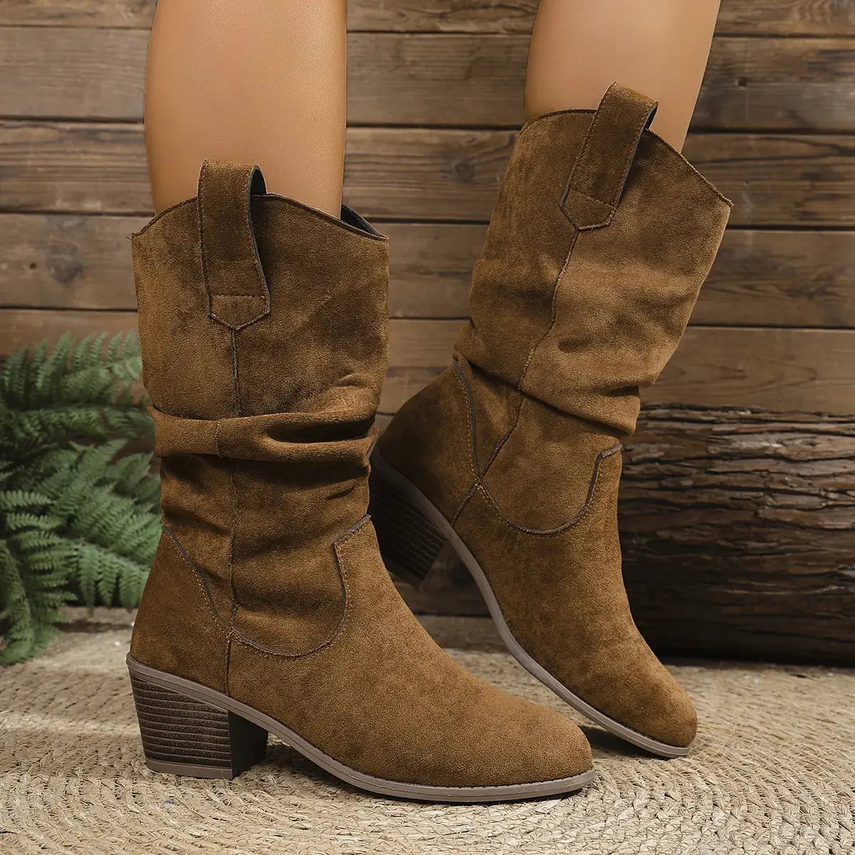 Brown suede mid-heel slouch boots with block heels.