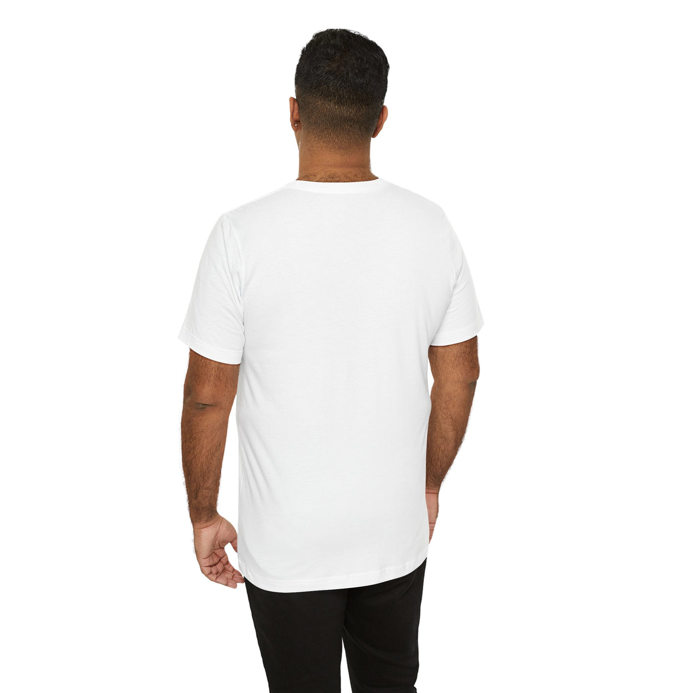 Back view of a man wearing a white t-shirt and black pants.