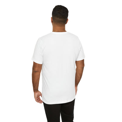 Back view of a man wearing a white t-shirt and black pants.