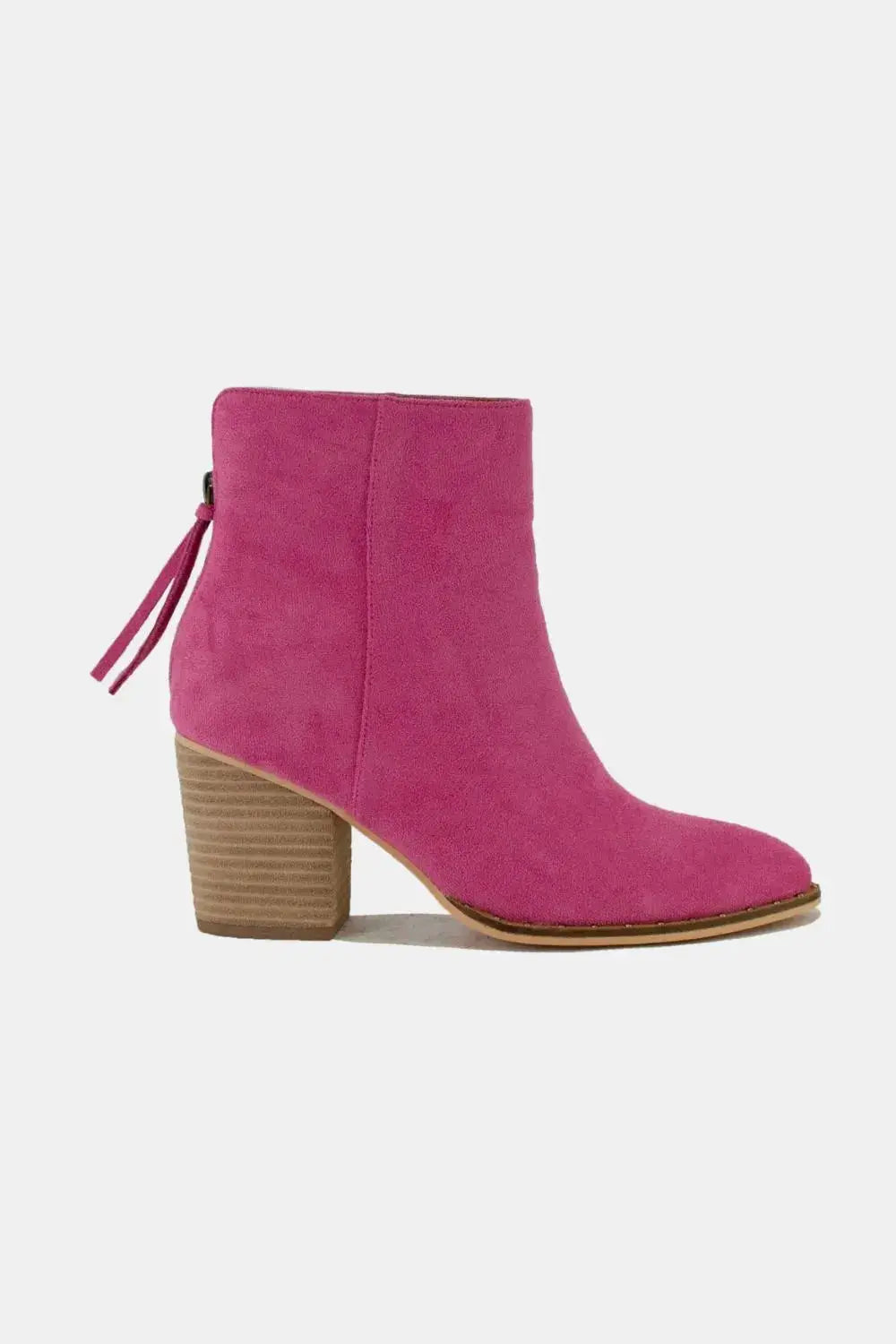 Pink suede ankle booties with a pointed toe and block heel.