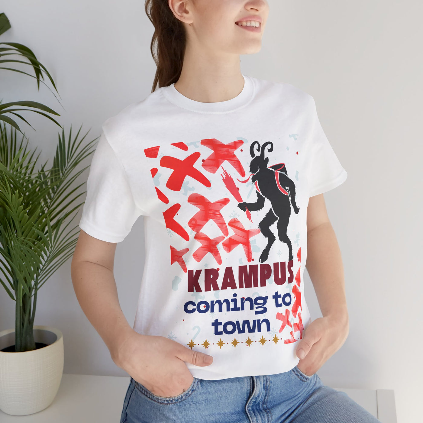 White t-shirt with a black Krampus graphic and "Krampus coming to town" text.